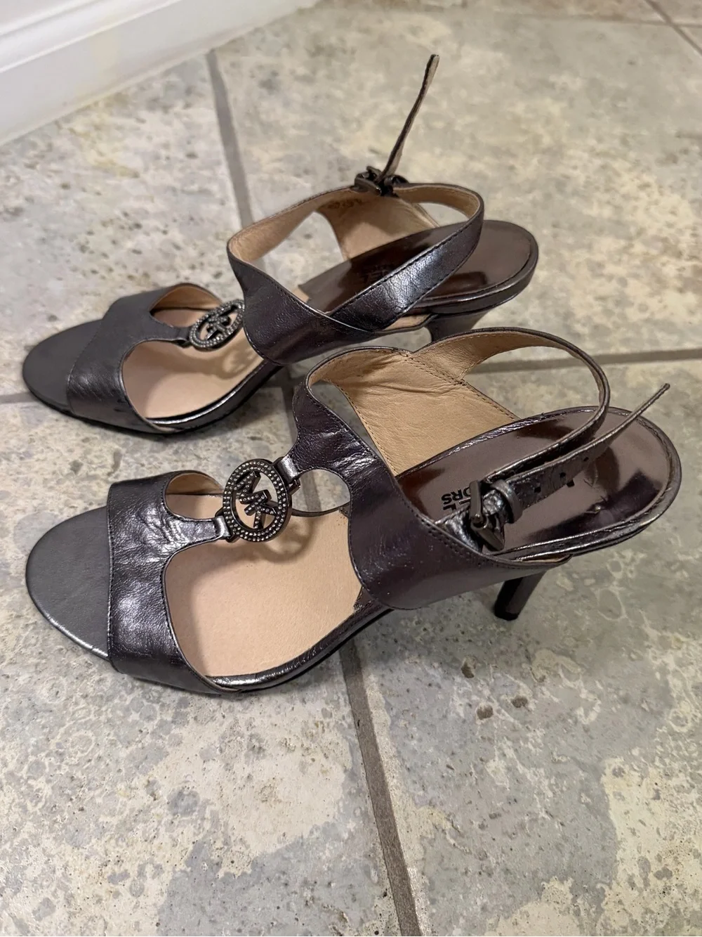 Michael Kors Shiny Silver Leather T-Strap Heels with MK Medallion Size 7.5